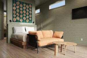 Outbound Yosemite Cabin room with bed and couch.